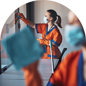 woman wearing orange and cleaning windows